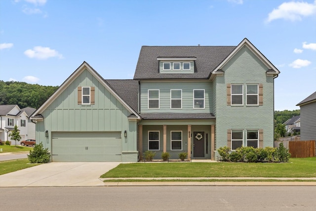 10787 Prairie Lake Dr, Apison, TN 37302 - craftsman house featuring driveway, roof with shingles, board and batten siding, a garage, and brick siding