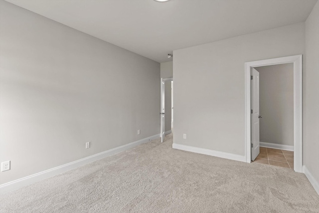 10787 Prairie Lake Dr, Apison, TN 37302 - spare room with light colored carpet and light tile patterned floors