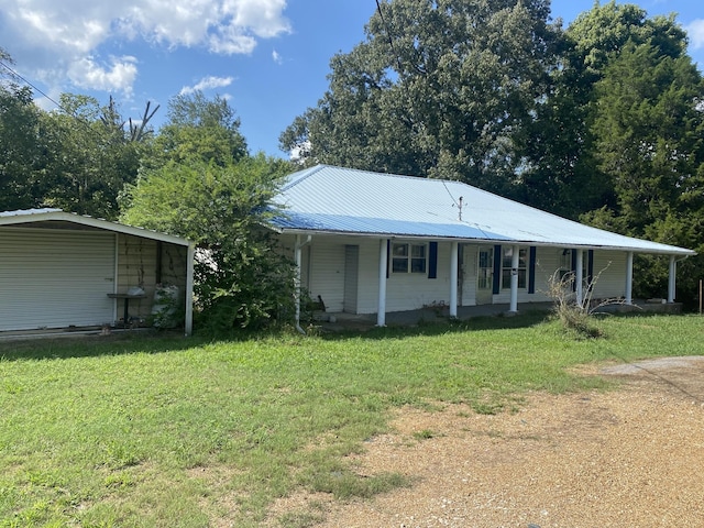 141 Maple St, Linden, TN 37096 - view of front facade with a porch, a front yard, and a metal roof