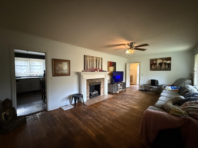 234 Ridgewood Ave, Paducah, KY 42001 - living area with dark wood-style floors, a stone fireplace, and a ceiling fan