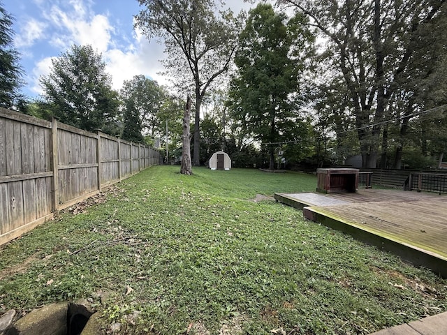 234 Ridgewood Ave, Paducah, KY 42001 - fenced backyard with a storage unit and a wooden deck