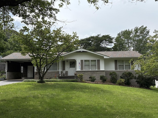 3919 Laird Ln, Chattanooga, TN 37415 - view of front of property with a front lawn, concrete driveway, an attached carport, and brick siding