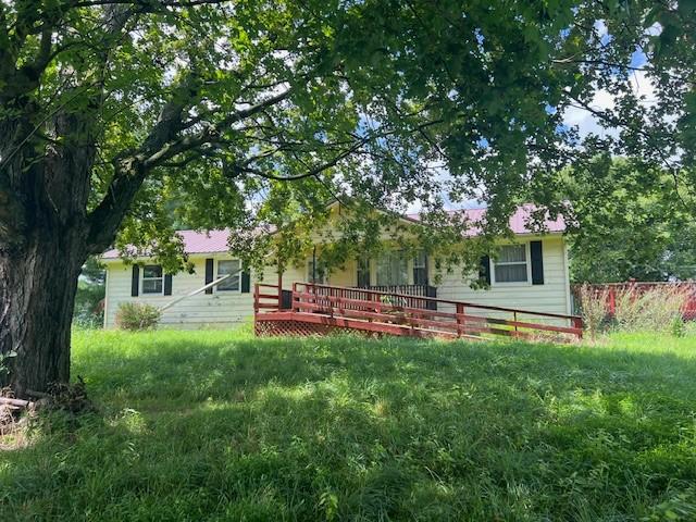 7569 Greenwood Rd, Cross Plains, TN 37049 - rear view of house featuring a deck