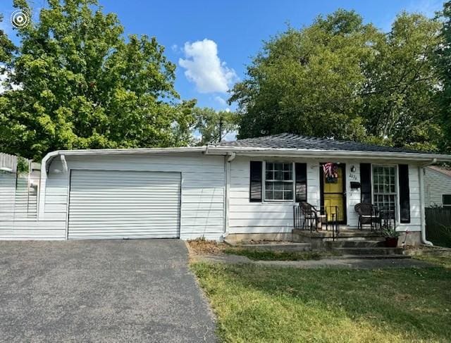 2626 Kenwood Dr, Hopkinsville, KY 42240 - view of front of house featuring an attached garage, driveway, and covered porch