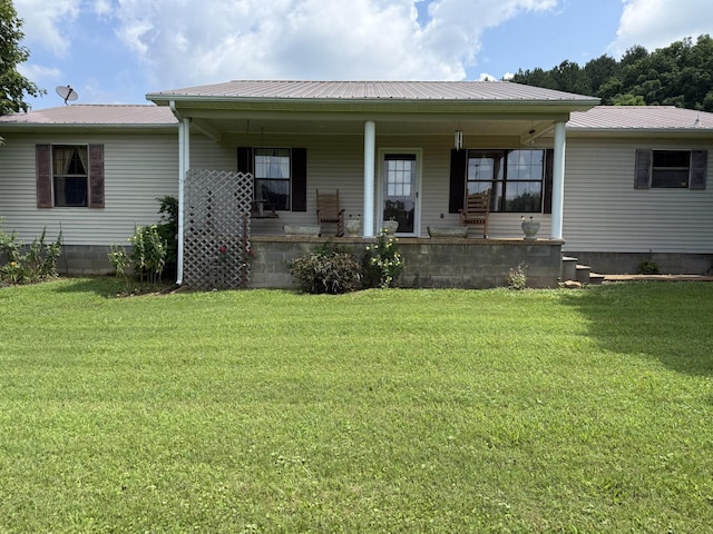 46 Brier Hill Rd, Ethridge, TN 38456 - rear view of property with a porch, a yard, and a metal roof