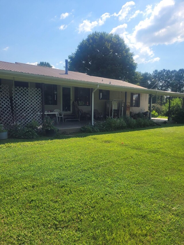 46 Brier Hill Rd, Ethridge, TN 38456 - rear view of house featuring a yard and a patio area