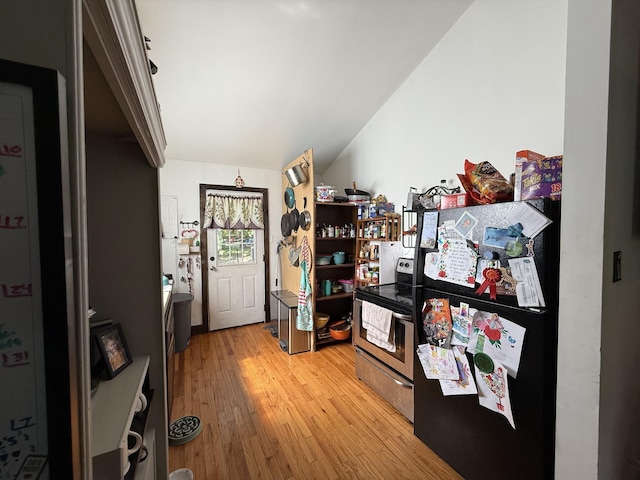 180 Webb Rd, Summertown, TN 38483 - kitchen with freestanding refrigerator, stainless steel electric range oven, and light wood-style floors