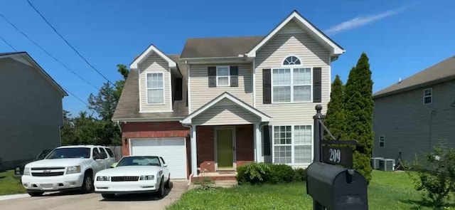 209 Grovedale Trce, Antioch, TN 37013 - traditional-style home featuring a garage, driveway, and a front lawn