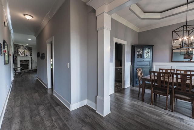 1652 Lantana Dr, Thompsons Station, TN 37179 - corridor with decorative columns, ornamental molding, dark wood-type flooring, and a chandelier