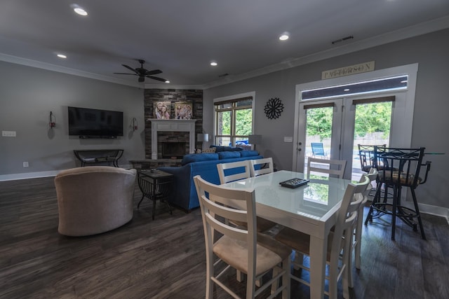 1652 Lantana Dr, Thompsons Station, TN 37179 - dining area featuring crown molding, a stone fireplace, dark wood-style flooring, recessed lighting, and ceiling fan