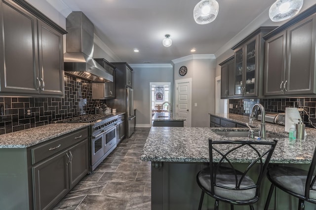 1652 Lantana Dr, Thompsons Station, TN 37179 - kitchen featuring stainless steel appliances, island exhaust hood, crown molding, dark stone countertops, and decorative backsplash