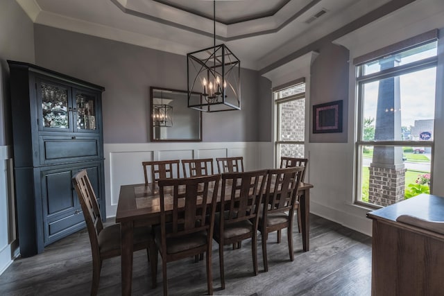 1652 Lantana Dr, Thompsons Station, TN 37179 - dining room with healthy amount of natural light, a chandelier, dark wood finished floors, a wainscoted wall, and a decorative wall