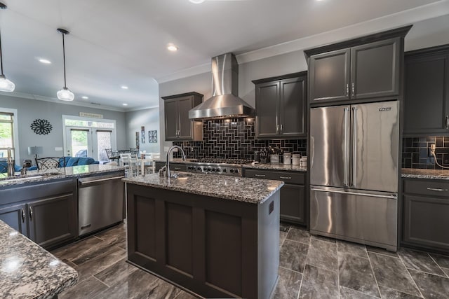 1652 Lantana Dr, Thompsons Station, TN 37179 - kitchen featuring appliances with stainless steel finishes, wall chimney exhaust hood, crown molding, dark stone countertops, and backsplash
