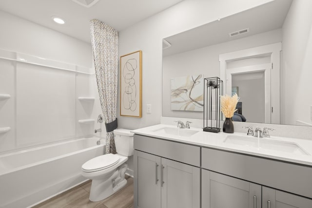 7214 Hanworth St, Fairview, TN 37062 - full bath featuring double vanity, shower / bath combo with shower curtain, recessed lighting, and wood finished floors