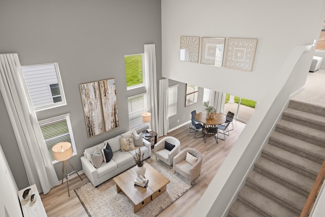 7214 Hanworth St, Fairview, TN 37062 - living area featuring a high ceiling, stairs, and wood finished floors