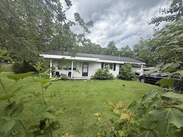 2317 Howell St, Cleveland, TN 37323 - ranch-style house featuring a front yard, a metal roof, and covered porch