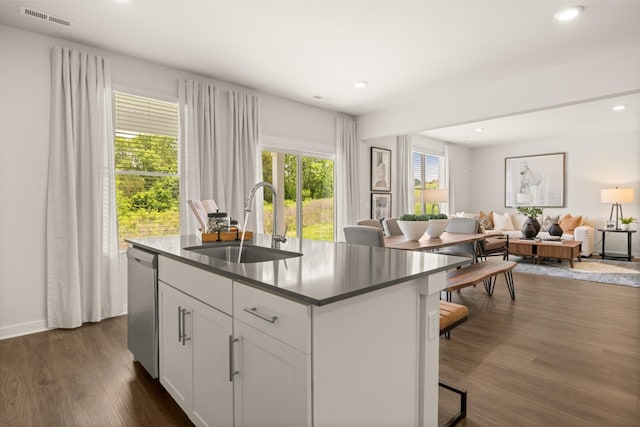 7212 Hanworth St, Fairview, TN 37062 - kitchen with stainless steel dishwasher, a kitchen island with sink, dark wood-type flooring, open floor plan, and recessed lighting