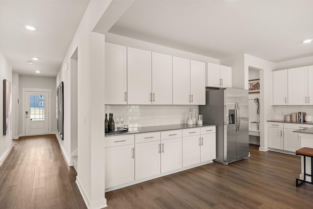 7212 Hanworth St, Fairview, TN 37062 - kitchen with stainless steel fridge with ice dispenser, dark wood-style floors, decorative backsplash, white cabinetry, and recessed lighting