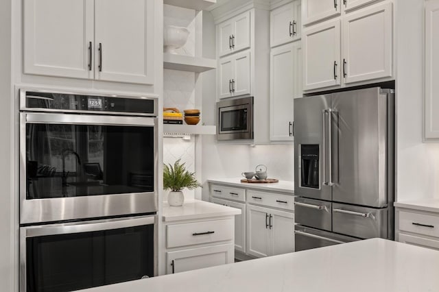 3364 Sarah Bee Ln, Thompsons Station, TN 37179 - kitchen with appliances with stainless steel finishes, light countertops, white cabinetry, and open shelves