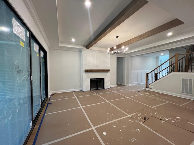 3364 Sarah Bee Ln, Thompsons Station, TN 37179 - unfurnished living room featuring stairway, beamed ceiling, a chandelier, a brick fireplace, and crown molding