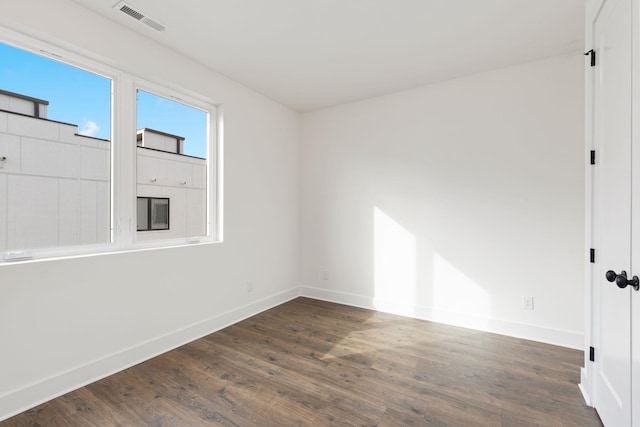 910 Youngs Ln Unit 4, Nashville, TN 37207 - spare room with dark wood-style floors and baseboards