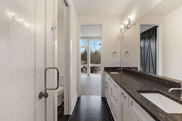 910 Youngs Ln Unit 4, Nashville, TN 37207 - bathroom featuring double vanity, a shower stall, and tile patterned flooring