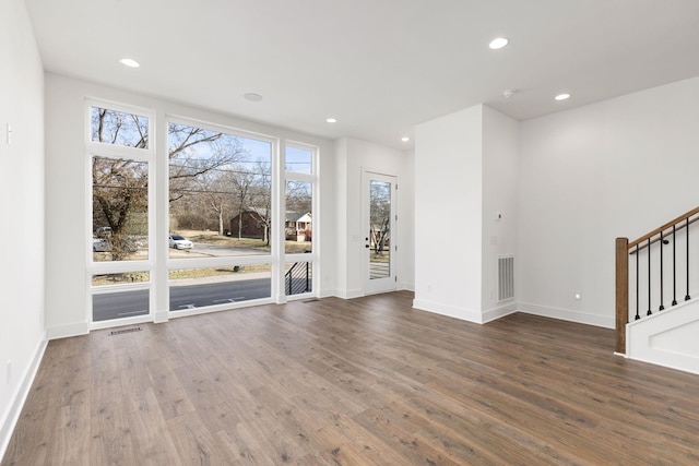 910 Youngs Ln Unit 4, Nashville, TN 37207 - unfurnished living room with wood finished floors, stairway, and recessed lighting
