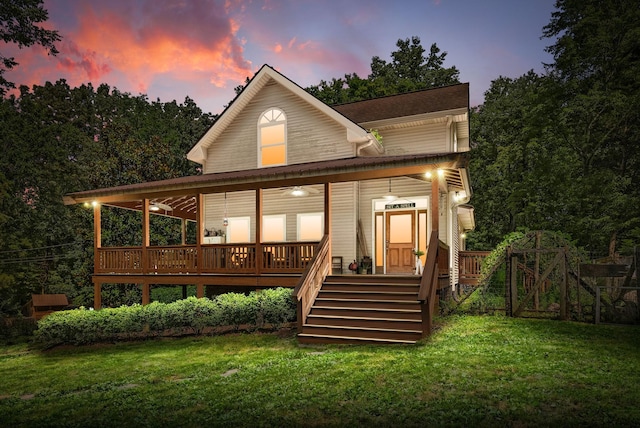 825 Durham Rd, Adams, TN 37010 - back of house at dusk featuring a yard, a deck, and stairs