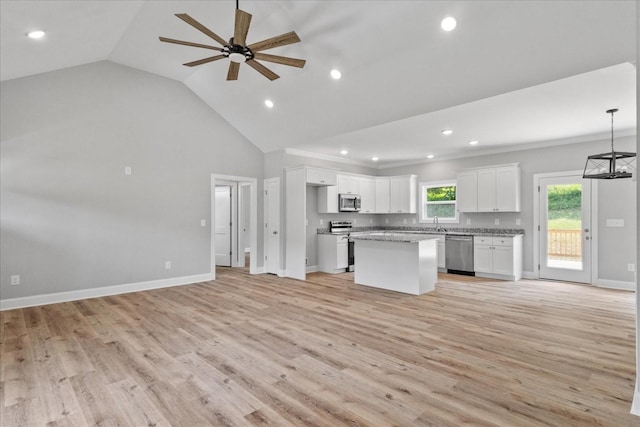 763 Potter Rd, Dickson, TN 37055 - kitchen with stainless steel appliances, open floor plan, white cabinets, a center island, and a ceiling fan