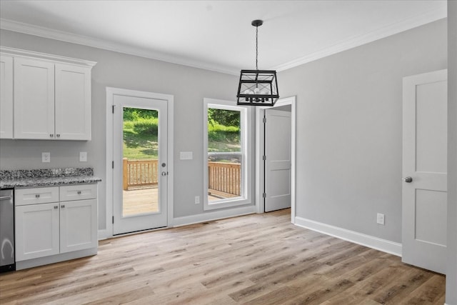 763 Potter Rd, Dickson, TN 37055 - unfurnished dining area featuring crown molding, light wood-style flooring, and a chandelier