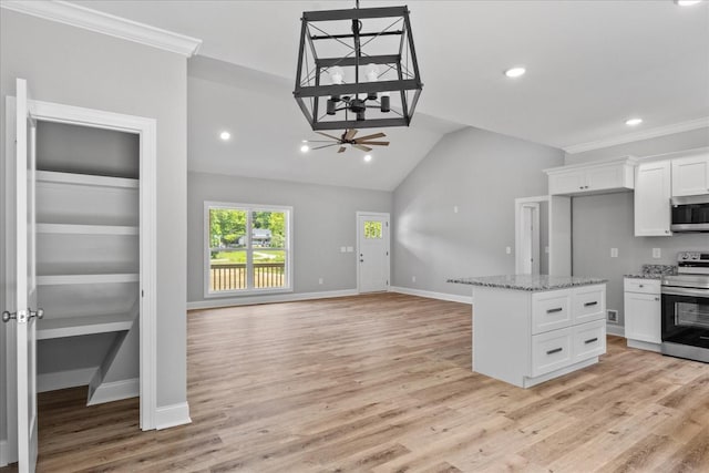 763 Potter Rd, Dickson, TN 37055 - kitchen with stainless steel appliances, a chandelier, white cabinetry, light stone counters, and lofted ceiling