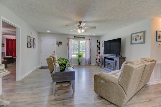 6117 Aedc Rd, Winchester, TN 37398 - living room featuring a ceiling fan, light wood-type flooring, a textured ceiling, and recessed lighting