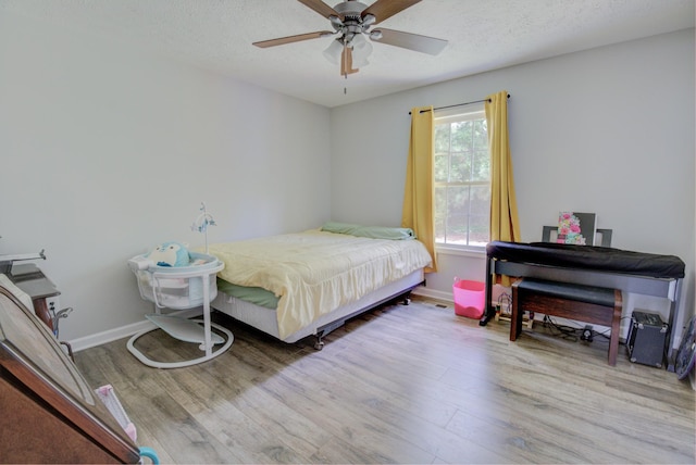 6117 Aedc Rd, Winchester, TN 37398 - bedroom featuring wood finished floors, a ceiling fan, and a textured ceiling