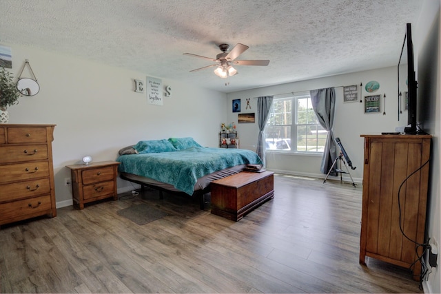 6117 Aedc Rd, Winchester, TN 37398 - bedroom with a textured ceiling, wood finished floors, and a ceiling fan