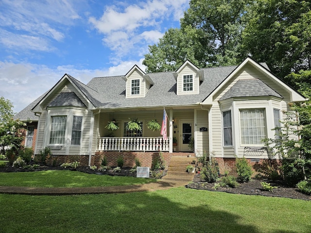 1104 Golf Course Ln, Ashland City, TN 37015 - view of front of property with a porch, a front yard, and roof with shingles