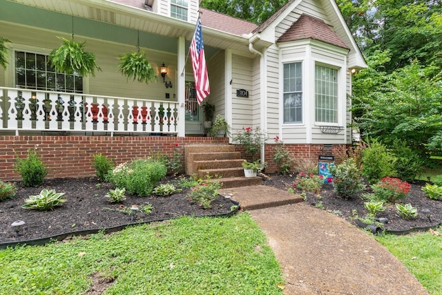1104 Golf Course Ln, Ashland City, TN 37015 - property entrance featuring covered porch and roof with shingles