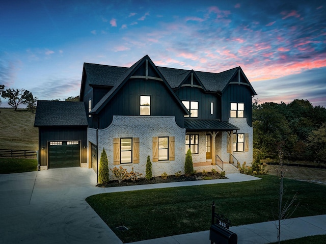 343 Circuit Rd, Franklin, TN 37064 - modern farmhouse style home featuring concrete driveway, a garage, board and batten siding, a shingled roof, and a standing seam roof