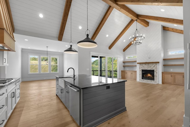 343 Circuit Rd, Franklin, TN 37064 - kitchen with stainless steel appliances, open floor plan, light wood-style floors, dark stone countertops, and recessed lighting