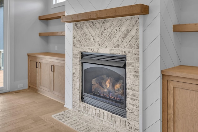 343 Circuit Rd, Franklin, TN 37064 - detailed view of a brick fireplace and wood finished floors