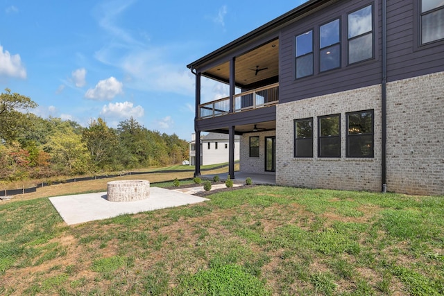 343 Circuit Rd, Franklin, TN 37064 - back of property featuring a balcony, a patio, a ceiling fan, a yard, and brick siding