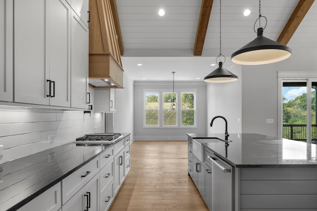 343 Circuit Rd, Franklin, TN 37064 - kitchen featuring stainless steel gas stovetop, beam ceiling, custom exhaust hood, light wood finished floors, and dishwashing machine