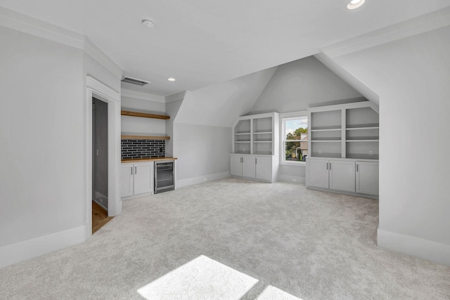 343 Circuit Rd, Franklin, TN 37064 - unfurnished living room featuring beverage cooler, carpet flooring, recessed lighting, a dry bar, and lofted ceiling
