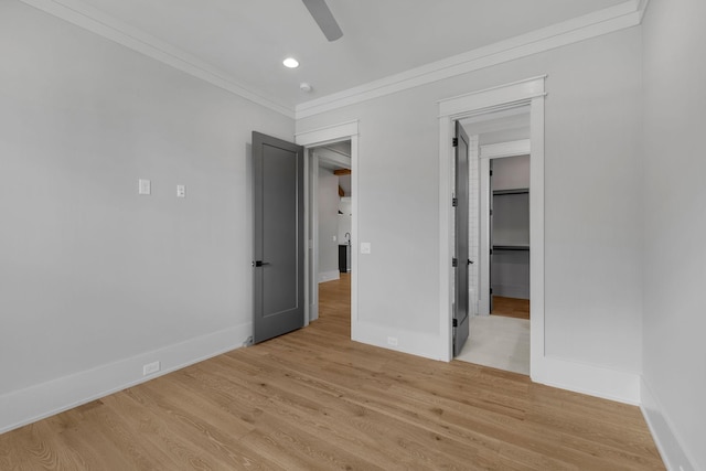 343 Circuit Rd, Franklin, TN 37064 - unfurnished bedroom with ornamental molding, light wood finished floors, recessed lighting, ceiling fan, and a walk in closet