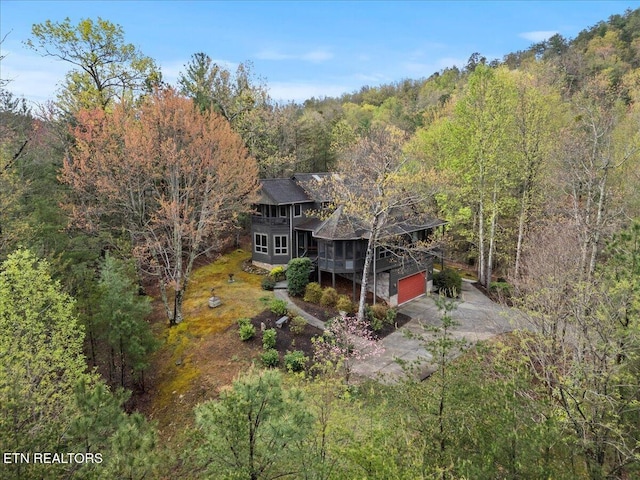 802 Stonegate Way, Townsend, TN 37882 - back of property featuring driveway, a forest view, and an attached garage