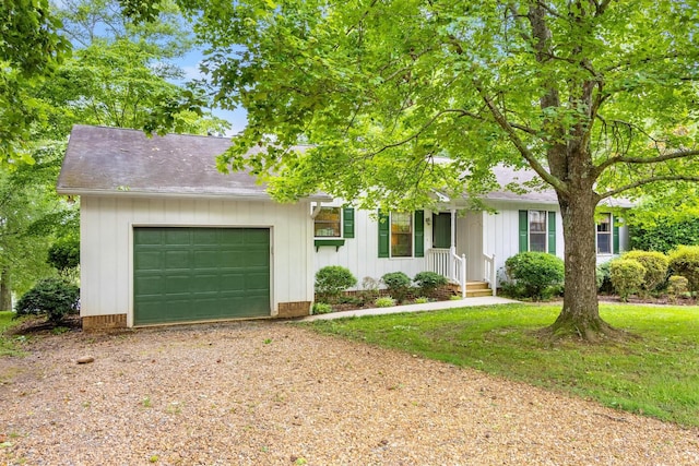 4416 Johnson Rd, Birchwood, TN 37308 - view of front of house featuring a garage, driveway, board and batten siding, and roof with shingles