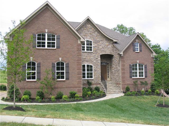 1098 Stonebridge Park Dr, Franklin, TN 37069 - view of front facade featuring a front lawn, brick siding, and stone siding
