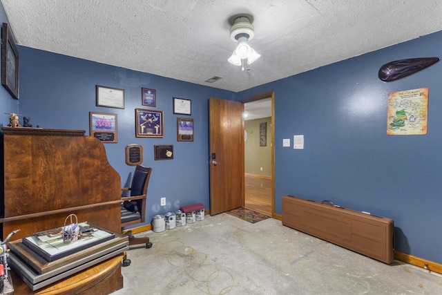 183 Jerry Smith Rd, Indian Mound, TN 37079 - miscellaneous room with a ceiling fan, concrete flooring, and a textured ceiling
