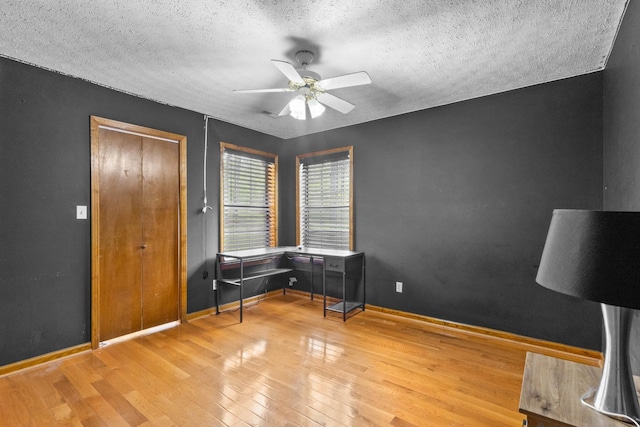 183 Jerry Smith Rd, Indian Mound, TN 37079 - home office featuring a ceiling fan, a textured ceiling, and wood finished floors