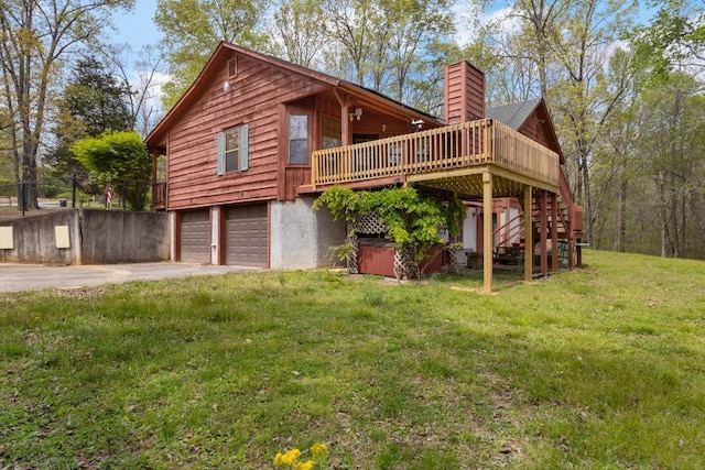 183 Jerry Smith Rd, Indian Mound, TN 37079 - back of house with a chimney, driveway, a wooden deck, a garage, and stairs