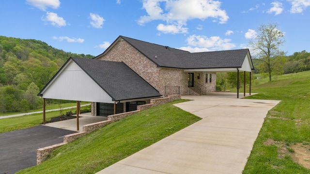 3945 Hartsville Rd, Lafayette, TN 37083 - view of side of property with asphalt driveway, a lawn, roof with shingles, and stone siding